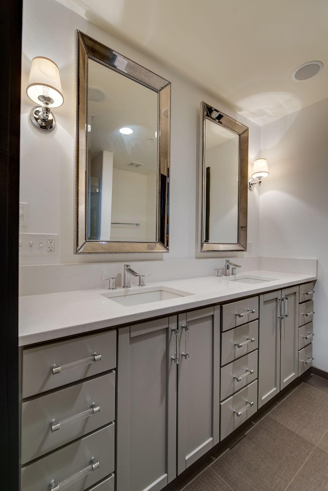 bathroom with vanity and tile patterned floors