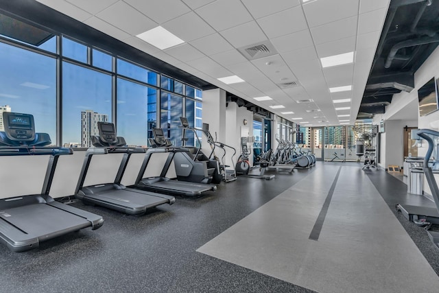 workout area featuring a drop ceiling