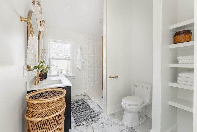 bathroom with walk in shower, toilet, and sink