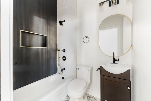 full bathroom featuring vanity, tiled shower / bath, and toilet