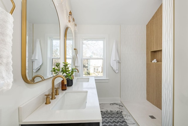 bathroom with vanity and a wealth of natural light