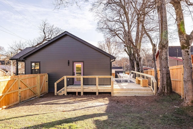 back of house featuring a deck