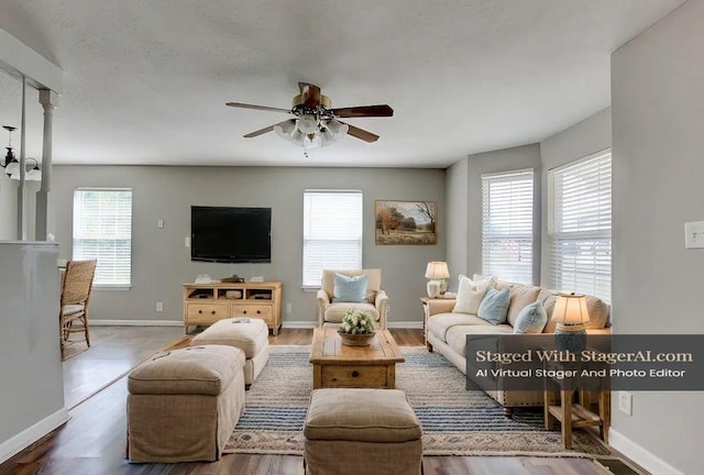 living room with ceiling fan and dark hardwood / wood-style floors