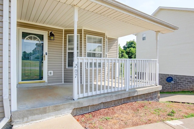 doorway to property with a porch