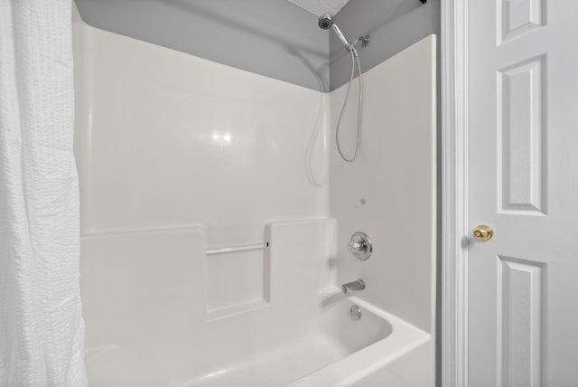 bathroom featuring shower / tub combo with curtain