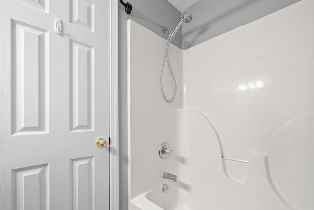 full bath featuring  shower combination