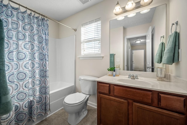 full bathroom with shower / bath combo, vanity, a textured ceiling, tile patterned floors, and toilet