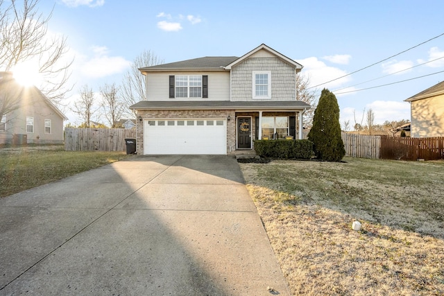 view of front property with a porch, a garage, and a front yard