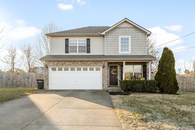 view of property with a garage and a front yard