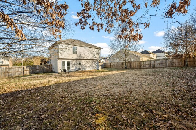 view of yard featuring french doors