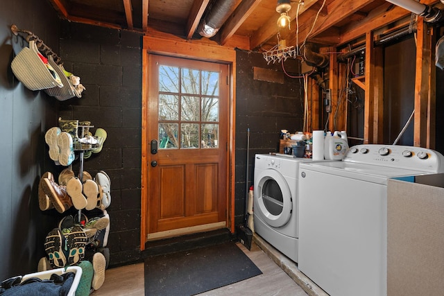 clothes washing area with washing machine and clothes dryer