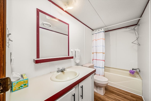 full bathroom with toilet, shower / bath combination with curtain, a textured ceiling, vanity, and hardwood / wood-style flooring