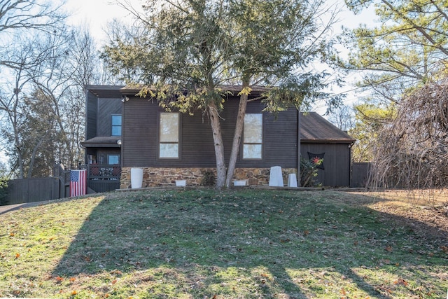 view of side of property featuring a yard