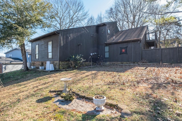 view of property exterior with a yard