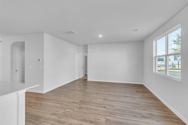 empty room with light hardwood / wood-style floors