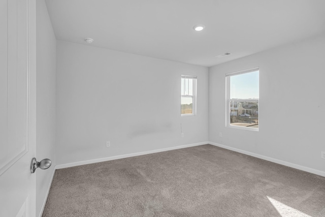 spare room featuring carpet floors