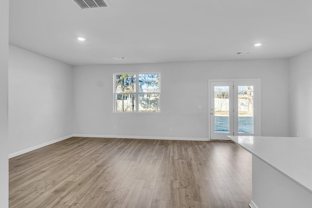 spare room featuring light hardwood / wood-style floors