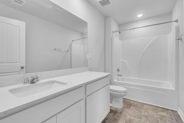 full bathroom featuring vanity, tub / shower combination, and toilet