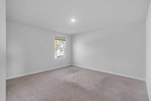 empty room with light colored carpet