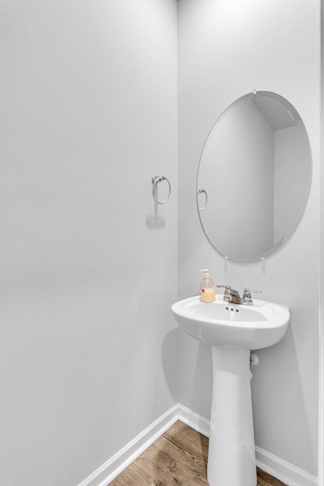 bathroom with wood-type flooring