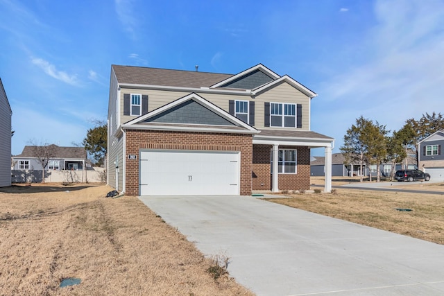 view of front of house with a garage and a front lawn