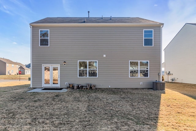 back of house featuring a patio, a yard, and cooling unit