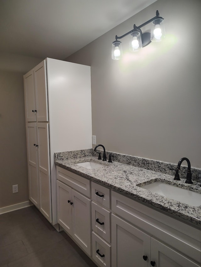 bathroom with vanity and tile patterned flooring