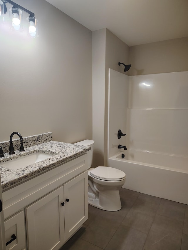 full bathroom with tile patterned floors, vanity, toilet, and  shower combination