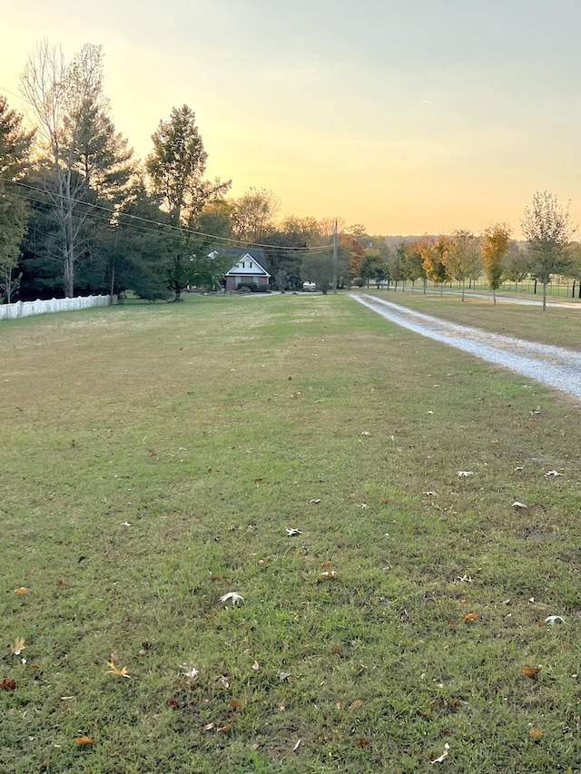 view of yard at dusk