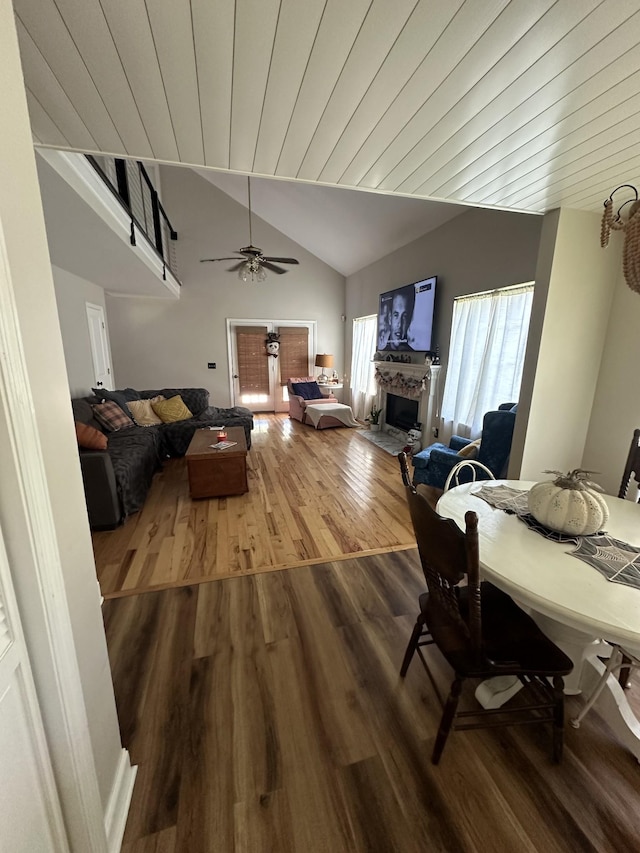 dining area featuring wood ceiling, ceiling fan, wood-type flooring, and vaulted ceiling