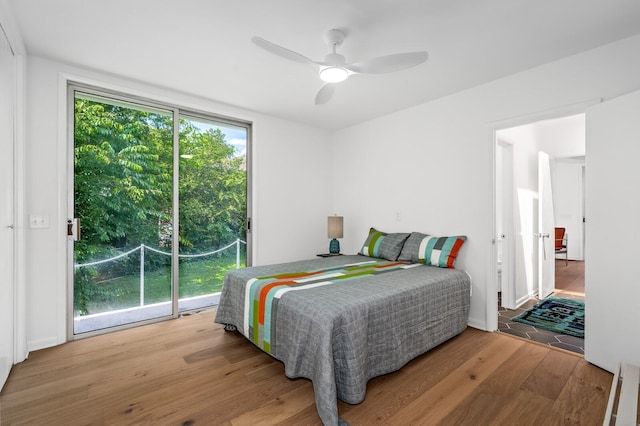 bedroom with ceiling fan and light hardwood / wood-style flooring