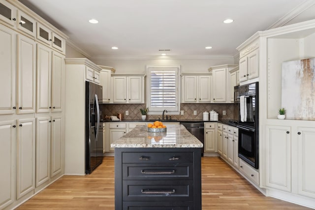 kitchen with dishwasher, a kitchen island, backsplash, and stainless steel fridge with ice dispenser