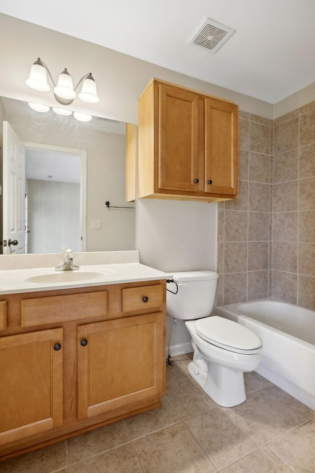 full bathroom featuring vanity, tub / shower combination, tile patterned floors, and toilet