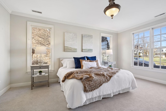 carpeted bedroom with ornamental molding