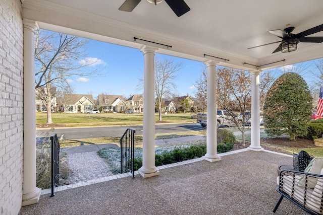 view of patio featuring ceiling fan and a porch