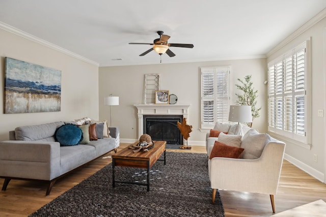 living room featuring crown molding, hardwood / wood-style floors, and ceiling fan