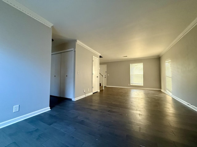 unfurnished room with crown molding and dark hardwood / wood-style flooring