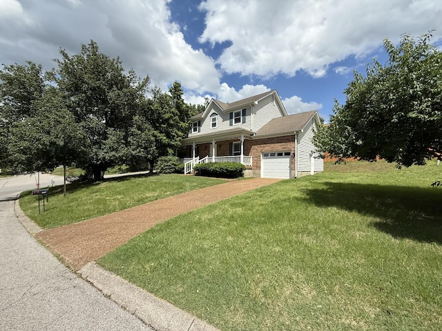 traditional home with covered porch, a front yard, an attached garage, brick siding, and driveway