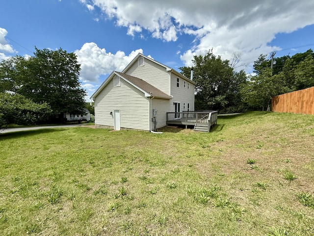 view of side of home with a wooden deck