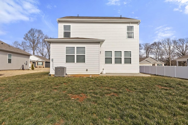 back of property with a patio, a yard, and cooling unit