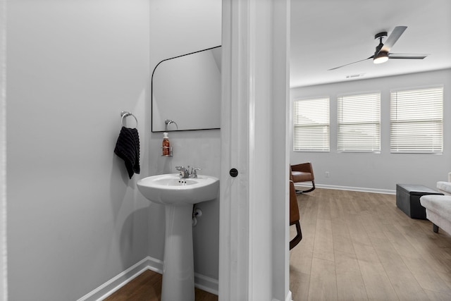 bathroom with wood-type flooring, sink, and ceiling fan