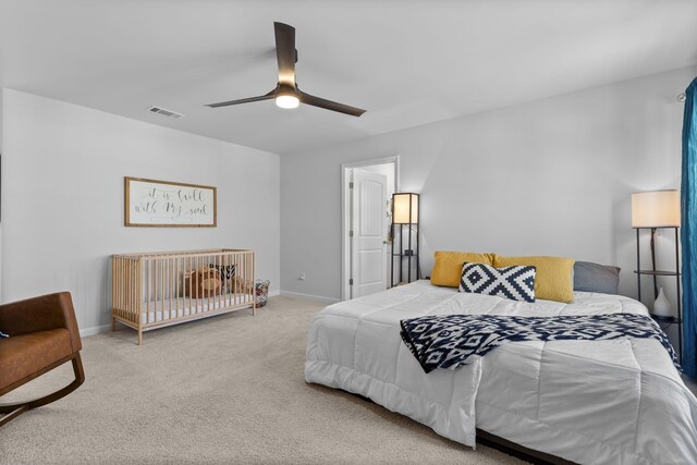 bedroom with ceiling fan and carpet flooring