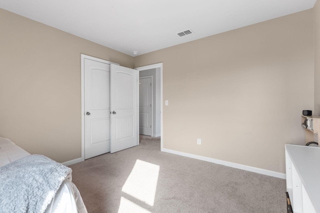 bedroom featuring light carpet