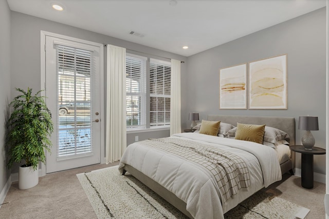 carpeted bedroom featuring access to exterior