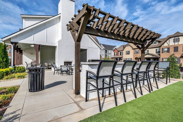 view of patio with a pergola and an outdoor bar