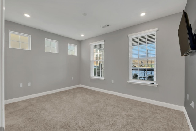 empty room with light colored carpet