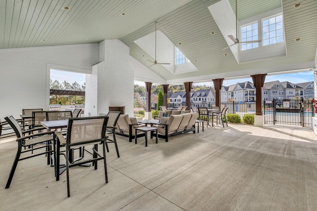 view of patio featuring an outdoor brick fireplace