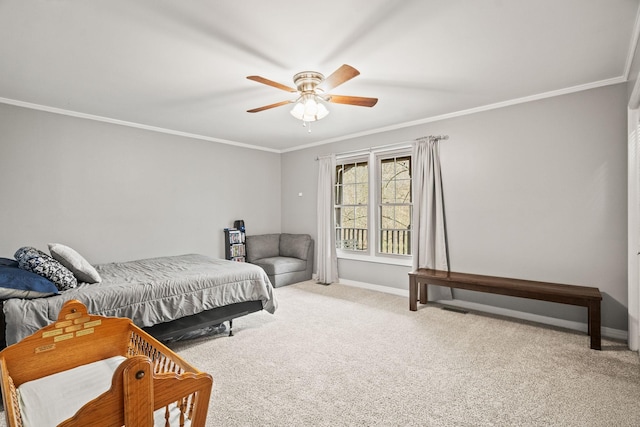 carpeted bedroom featuring ceiling fan and ornamental molding