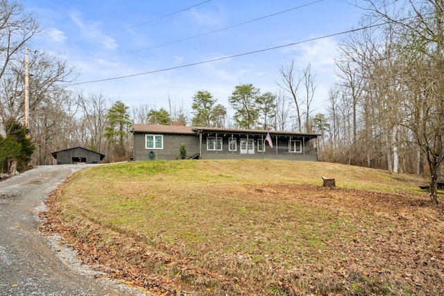 ranch-style house featuring a front lawn