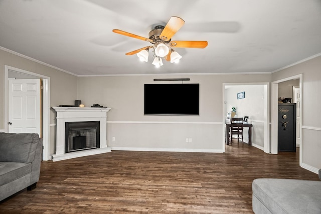 living room with ornamental molding, dark hardwood / wood-style floors, and ceiling fan